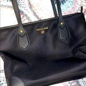 Michael Kors purse never used. Original price 128.00 will sell for 70.00